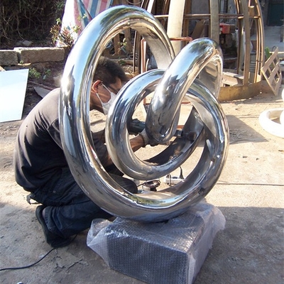 Les sculptures d'intérieur modernes en métal de miroir de cercle soustraient l'acier inoxydable